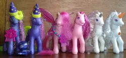Size: 640x299 | Tagged: safe, derpibooru import, princess crystal, princess silver swirl, pegasus, pony, unicorn, comb, crystal ball, g2, princess hat, princess twinkle star, toy, twinkle star, wings