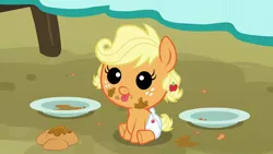 Size: 600x338 | Tagged: safe, derpibooru import, screencap, applejack, earth pony, pony, apple family reunion, :p, :t, apple fritter (food), baby, babyjack, cute, diaper, female, foal, food, jackabetes, messy eating, plate, smiling, solo, tongue out, younger