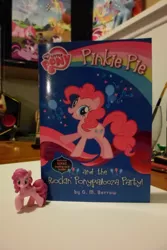 Size: 3072x4608 | Tagged: blind bag, book, derpibooru import, figure, irl, merchandise, my little pony chapter books, photo, pinkie pie, pinkie pie and the rockin' ponypalooza party!, safe, toy