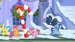 Size: 960x540 | Tagged: safe, derpibooru import, screencap, lemon hearts, minuette, ruby pinch, scootaloo, hearth's warming eve (episode), 8 foot candy cane, candy, candy cane, food, hearth's warming eve, licking, stuck, tongue out, tongue stuck to pole