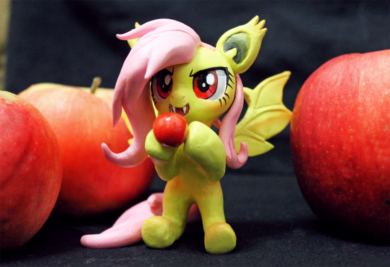 Size: 1200x822 | Tagged: safe, artist:aplexpony, derpibooru import, fluttershy, bat pony, pony, bats!, apple, bat ponified, bipedal, clay, craft, figurine, flutterbat, food, irl, photo, race swap, sculpture, solo