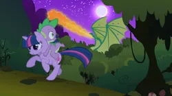 Size: 1054x592 | Tagged: safe, derpibooru import, screencap, reginald, spike, twilight sparkle, dragon, pony, unicorn, owl's well that ends well, dragons riding ponies, everfree forest, fire, fire breath, moon, night, riding, running, spread wings, unicorn twilight, wings