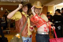 Size: 2048x1365 | Tagged: 2013, apple, applejack, artist:lochlan o'neil, artist needed, basket, belly button, braeburn, clothes, convention, cosplay, costume, cowboy hat, derpibooru import, food, front knot midriff, hat, human, irl, irl human, jeans, midriff, ndk, pants, photo, plushie, safe