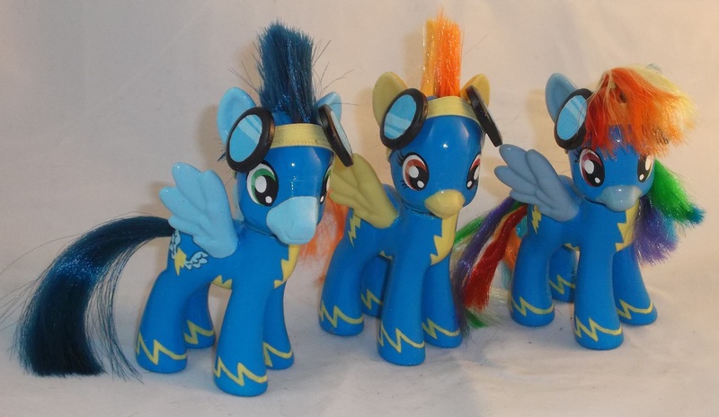 Size: 3369x1953 | Tagged: artist:gryphyn-bloodheart, brushable, clothes, custom, derpibooru import, irl, photo, rainbow dash, safe, soarin', spitfire, toy, uniform, wonderbolts, wonderbolts uniform