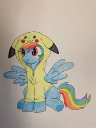 Size: 2448x3264 | Tagged: safe, artist:scarlet-spectrum, derpibooru import, rainbow dash, pikachu, :3, clothes, cute, dashabetes, floppy ears, hoodie, pokémon, rainbowchu, sitting, smiling, solo, spread wings, underhoof, wings