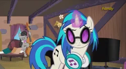 Size: 960x528 | Tagged: safe, derpibooru import, screencap, octavia melody, vinyl scratch, pony, slice of life (episode), bipedal, cello, glasses, headphones, magic, musical instrument, piano, raised eyebrow, table, telekinesis