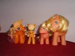 Size: 259x194 | Tagged: safe, derpibooru import, applejack, applejack (g1), baby applejack, comparison, g1, g3, g4, generational ponidox, hat, irl, needs more jpeg, photo, picture for breezies, toy