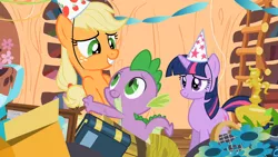 Size: 1280x720 | Tagged: safe, derpibooru import, screencap, applejack, spike, twilight sparkle, dragon, earth pony, pony, unicorn, secret of my excess, bipedal, book, bookshelf, eye contact, female, flower, golden oaks library, hat, hug, looking at each other, male, mare, party hat, smiling, trio, unicorn twilight