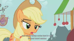 Size: 853x473 | Tagged: safe, derpibooru import, screencap, applejack, earth pony, pony, call of the cutie, apron, clothes, female, mare, solo, turkey nodes, youtube caption