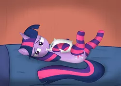 Size: 900x643 | Tagged: suggestive, artist:nostalgiagamerjs, derpibooru import, twilight sparkle, pony, unicorn, bed, bedroom eyes, clothes, female, mare, on back, pillow, smiling, socks, solo, solo female, striped socks