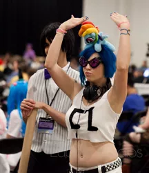 Size: 500x578 | Tagged: safe, artist:meggchan, banned from derpibooru, deleted from derpibooru, derpibooru import, rainbow dash, vinyl scratch, human, bronycon, belly button, clothes, convention, cosplay, costume, headphones, irl, irl human, photo, piercing, plushie, pony hat, solo