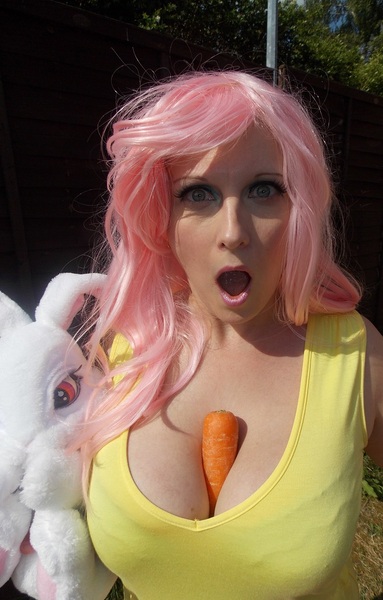 Size: 702x1100 | Tagged: suggestive, artist:lezlidax, banned from derpibooru, deleted from derpibooru, derpibooru import, angel bunny, fluttershy, human, between breasts, breasts, carrot, cleavage, clothes, cosplay, costume, female, food, irl, irl human, photo, plushie, solo, solo female