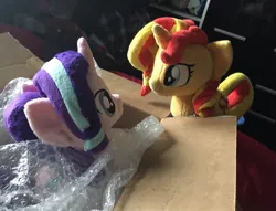 Size: 1200x919 | Tagged: artist needed, safe, artist:dvixie, banned from derpibooru, deleted from derpibooru, derpibooru import, starlight glimmer, sunset shimmer, pony, unicorn, box, bubble wrap, duo, irl, looking at each other, photo, plushie, pony in a box