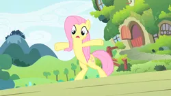 Size: 1280x720 | Tagged: safe, ponibooru import, screencap, fluttershy, pegasus, pony, the cutie mark chronicles, bipedal, come at me bro, female, fluttershy's cottage, hooves in air, looking down, mare, meme, open mouth, outdoors, solo, standing