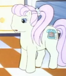 Size: 505x575 | Tagged: safe, derpibooru import, screencap, earth pony, pony, my little pony tales, too sick to notice, bangs, blue eyes, checkered floor, concerned, female, full body, g1, image, jpeg, kitchen, long hair, mare, misty (g1), pastel, pink hair, ponytail, scunchie, shocked, solo, teenager, yellow coat