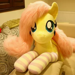 Size: 3247x3247 | Tagged: safe, artist:ponimalion, derpibooru import, fluttershy, pegasus, pony, bed, clothes, female, image, irl, jpeg, life size, mare, photo, plushie, socks, solo, striped socks