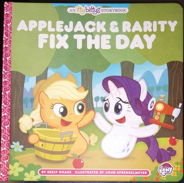 Size: 2043x2036 | Tagged: safe, artist:john sprengelmeyer, derpibooru import, applejack, rarity, earth pony, pony, unicorn, apple, applejack and rarity fix the day, book, cute, food, hallmark, image, jackabetes, jpeg, merchandise, no legs, raribetes, sewing machine, storybook