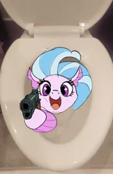 Size: 1181x1823 | Tagged: safe, artist:cadillacdynamite, derpibooru import, silverstream, pony, seapony (g4), cute, delet this, diastreamies, gun, image, irl, jpeg, looking at you, open mouth, photo, ponies in real life, solo, toilet, weapon