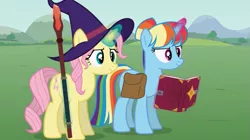 Size: 851x477 | Tagged: safe, artist:agrol, derpibooru import, fluttershy, rainbow dash, pony, unicorn, alternate hairstyle, bag, book, glow, glowing horn, hairstyle, hat, horn, image, let's start the game, png, race swap, saddle bag, spellbook, staff, unicorn fluttershy, unicorn rainbow dash, wizard hat, youtube link