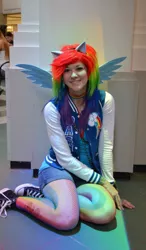 Size: 561x960 | Tagged: safe, artist:glitzygeekgirl, derpibooru import, rainbow dash, human, 2012, animecon, choker, clothes, converse, cosplay, costume, fishnets, image, irl, irl human, jpeg, multicolored hair, photo, rainbow hair, shoes, shorts, tattoo