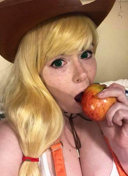 Size: 698x960 | Tagged: suggestive, artist:mintyblitzz, derpibooru import, applejack, human, apple, breasts, cleavage, clothes, cosplay, costume, food, image, irl, irl human, jpeg, photo