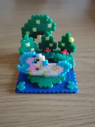 Size: 1488x1984 | Tagged: safe, artist:mariothepixelarter, derpibooru import, princess celestia, alicorn, pony, craft, female, image, irl, jpeg, lying down, mare, perler beads, photo, prone, solo, tree