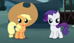 Size: 494x287 | Tagged: safe, derpibooru import, screencap, apple bloom, applejack, rarity, sweetie belle, earth pony, pony, unicorn, magic duel, :o, applejack's hat, cowboy hat, cropped, cute, disguise, female, filly, filly applejack, filly rarity, foal, hat, jackabetes, looking at you, open mouth, ponyville, raribetes, statue, younger