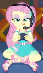 Size: 324x551 | Tagged: safe, derpibooru import, screencap, fluttershy, equestria girls, equestria girls series, game stream, spoiler:eqg series (season 2), clothes, concentrating, controller, couch, cropped, crossed legs, cute, cutie mark, cutie mark on clothes, dress, female, fluttershy boho dress, geode of fauna, hairpin, headphones, headset mic, image, jewelry, magical geodes, necklace, open-toed shoes, png, shyabetes, sitting, sleeveless, sunset shimmer's house, tongue out