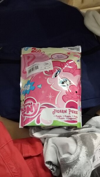 Size: 1088x1920 | Tagged: safe, derpibooru import, photographer:rautamiekka, pinkie pie, earth pony, pony, bag, female, finnish, jigsaw puzzle, mare, package, photo, shop