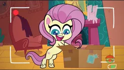 Size: 1280x720 | Tagged: safe, derpibooru import, screencap, fluttershy, pegasus, pony, my little pony: pony life, unboxing day, spoiler:pony life s01e18, spoiler:pony life s01e30, animation error, box, female, fluttershy's cottage, missing wing, no wing, recording, smiling, solo, treehouse logo, wingless, wingless fluttershy