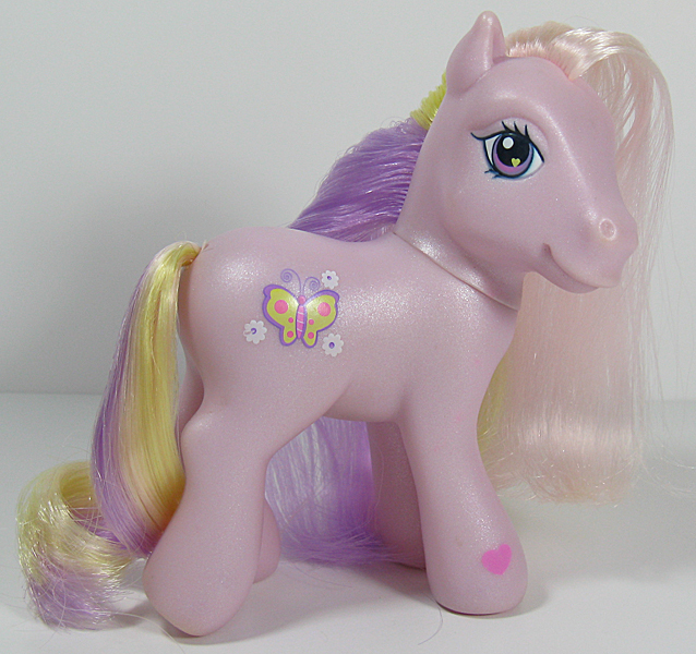 Size: 638x600 | Tagged: safe, derpibooru import, photographer:breyer600, fluttershy (g3), butterfly, earth pony, insect, pony, cute, cutie mark, female, flower, g3, heart eyes, looking at you, mare, photo, smiling, solo, toy, wingding eyes