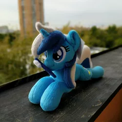 Size: 1944x1944 | Tagged: safe, artist:burgunzik, derpibooru import, minuette, pony, irl, lying down, mouth hold, photo, plushie, prone, solo, toothbrush