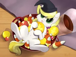 Size: 1600x1200 | Tagged: safe, artist:kebchach, derpibooru import, oc, oc:dandelion blossom, unofficial characters only, pony, :<, bowl, candy, candy bowl, candy corn, cheek fluff, commission, cute, dock, food, halloween, hat, holiday, lying down, ocbetes, on back, solo, tiny, tiny ponies, tongue out, underhoof, witch hat, ych result