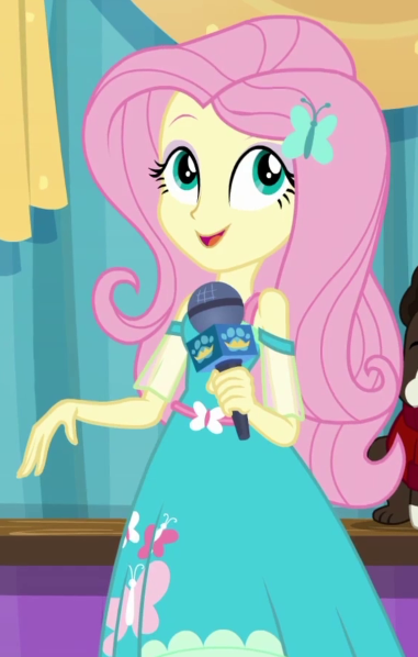 Size: 381x598 | Tagged: safe, derpibooru import, screencap, fluttershy, best in show: the pre-show, equestria girls, equestria girls series, spoiler:eqg series (season 2), best in show logo, cropped, cute, female, microphone, shyabetes, solo