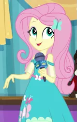 Size: 381x598 | Tagged: safe, derpibooru import, screencap, fluttershy, best in show: the pre-show, equestria girls, equestria girls series, spoiler:eqg series (season 2), best in show logo, cropped, cute, female, microphone, shyabetes, solo