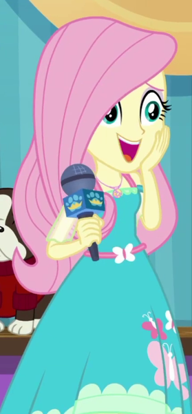 Size: 285x612 | Tagged: safe, derpibooru import, screencap, fluttershy, dog, best in show: the pre-show, equestria girls, equestria girls series, spoiler:eqg series (season 2), best in show logo, cropped, cute, female, microphone, open mouth, shyabetes, smiling, solo