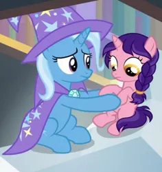 Size: 620x658 | Tagged: safe, derpibooru import, screencap, raspberry dazzle, trixie, pony, unicorn, the ending of the end, cape, clothes, cropped, female, filly, hat, holding a pony, looking down, trixie's cape, trixie's hat