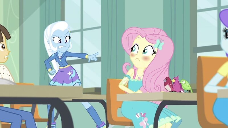 Size: 972x547 | Tagged: safe, derpibooru import, screencap, fluttershy, trixie, wiz kid, bird, a little birdie told me, equestria girls, equestria girls series, angry, blushing, female, male, pointing