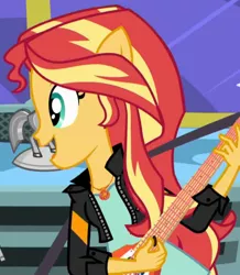Size: 624x715 | Tagged: safe, derpibooru import, screencap, sunset shimmer, eqg summertime shorts, equestria girls, get the show on the road, cropped, geode of empathy, guitar, guitar pick, magical geodes, musical instrument, ponied up, pony ears, solo
