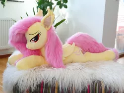 Size: 3024x2268 | Tagged: safe, artist:epicrainbowcrafts, derpibooru import, fluttershy, bat pony, pony, bat ponified, bedroom eyes, flutterbat, image, irl, jpeg, lying down, photo, plushie, prone, race swap, solo