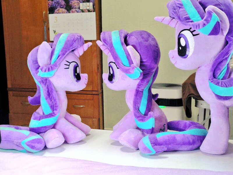 Size: 1024x768 | Tagged: safe, artist:nekokevin, derpibooru import, starlight glimmer, pony, unicorn, series:nekokevin's glimmy, female, image, irl, jpeg, mare, photo, plushie, self ponidox, sitting, size difference, smiling, table, trio, underhoof