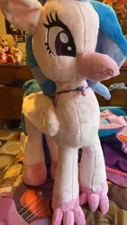 Size: 1980x3520 | Tagged: safe, artist:mezairplush, derpibooru import, photographer:savygriffs, silverstream, hippogriff, bed, female, image, irl, jewelry, jpeg, necklace, photo, plushie