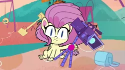 Size: 1280x720 | Tagged: safe, derpibooru import, screencap, fluttershy, pegasus, my little pony: pony life, spoiler:pony life season 2, bag, camera, image, messy mane, playground, png, sitting, slit eyes, solo, surprised, tripod, wings