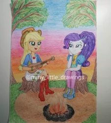 Size: 1080x1196 | Tagged: safe, artist:mmy_little_drawings, derpibooru import, applejack, rarity, equestria girls, amputee, bedroom eyes, boots, campfire, clothes, eyelashes, female, guitar, high heel boots, high heels, image, jpeg, lesbian, musical instrument, open mouth, outdoors, rarijack, shipping, shoes, shorts, sitting, smiling, stump, sunset, traditional art, watermark