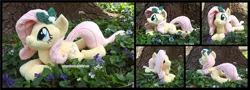 Size: 4890x1754 | Tagged: safe, artist:peruserofpieces, derpibooru import, fluttershy, pegasus, pony, beanie (plushie), female, flower, holly, image, irl, lying down, mare, photo, plushie, png, prone, smiling, sploot, tree, wings