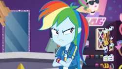 Size: 3410x1920 | Tagged: safe, derpibooru import, screencap, rainbow dash, equestria girls, equestria girls series, holidays unwrapped, spoiler:eqg series (season 2), angry, clothes, crossed arms, cutie mark, cutie mark on clothes, dashing through the mall, female, geode of super speed, hoodie, image, jewelry, jpeg, magical geodes, necklace, rainbow dash is not amused, solo, unamused