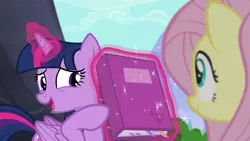 Size: 1280x720 | Tagged: safe, derpibooru import, screencap, fluttershy, twilight sparkle, twilight sparkle (alicorn), alicorn, pony, the hooffields and mccolts, book, duo, female, image, magic, mare, png