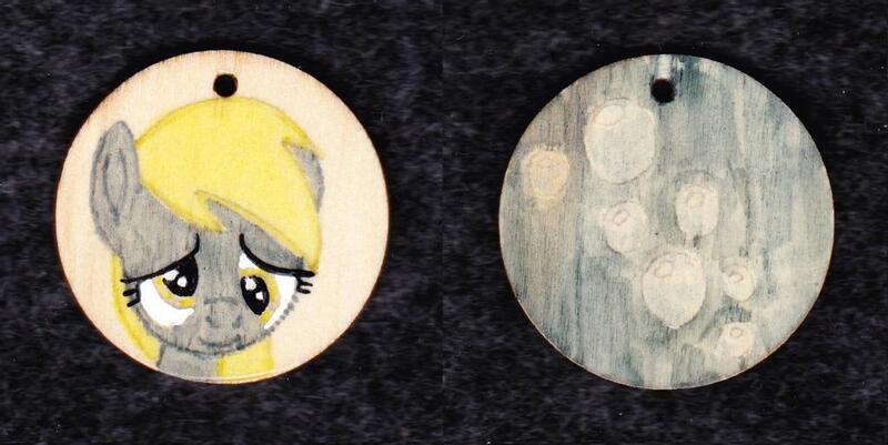 Size: 1024x513 | Tagged: safe, artist:malte279, derpibooru import, derpy hooves, pegasus, pony, craft, cutie mark, female, image, jewelry, jpeg, pendant, traditional art, wood