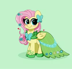 Size: 3200x3100 | Tagged: safe, artist:kittyrosie, derpibooru import, fluttershy, pegasus, pony, blushing, clothes, cute, dress, female, flower, flower in hair, gala dress, green background, green eyes, heart, image, jpeg, looking at you, mare, shyabetes, simple background, smiling