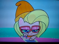 Size: 4160x3120 | Tagged: safe, derpibooru import, screencap, buttershy, pegasus, pony, cute-pocalypse meow, my little pony: pony life, spoiler:pony life s01e03, bracelet, glasses, hat, image, jewelry, jpeg, photo, picture of a screen, ponies with technology, solo, tablet